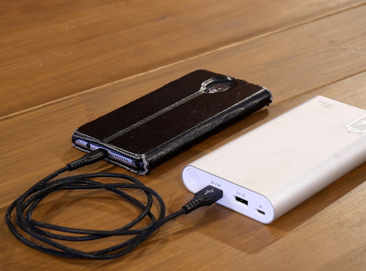 Smartphone connected to a portable power bank
