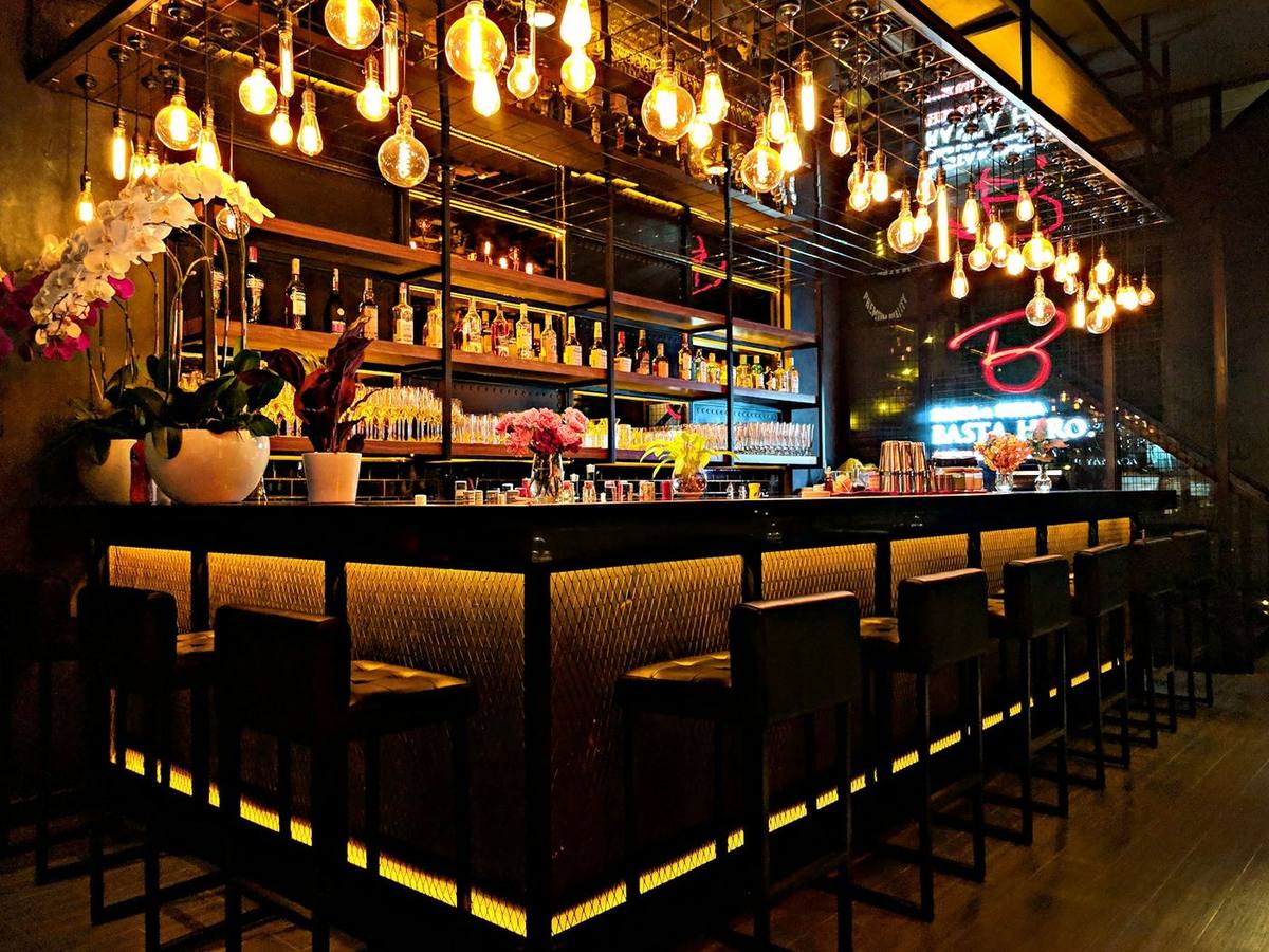 Upscale cocktail bar with pendant lighting